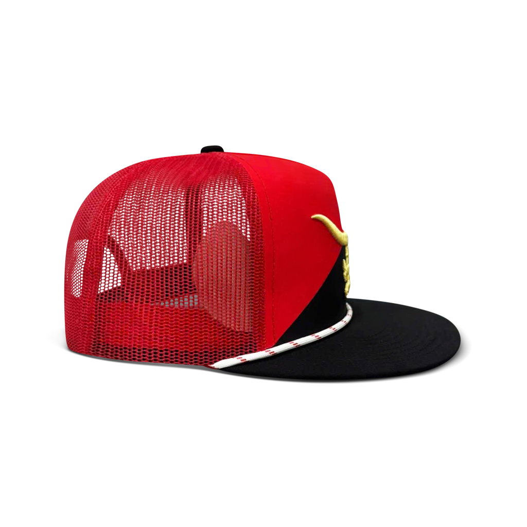 World Champion red and black trucker hat held in hand, gold logo on red crown with black flat brim