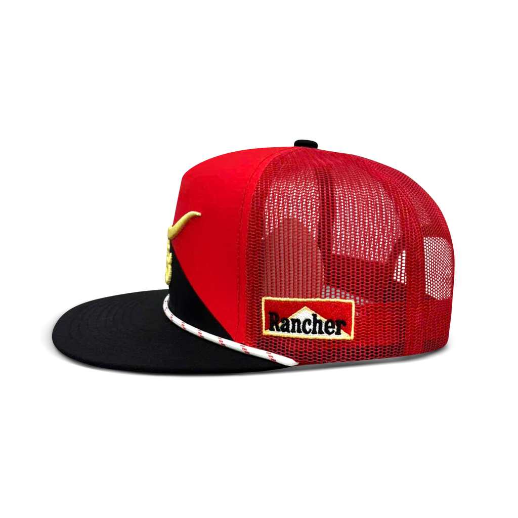 World Champion red and black flat bill trucker hat, angled view showing gold embroidered longhorn and black mesh back