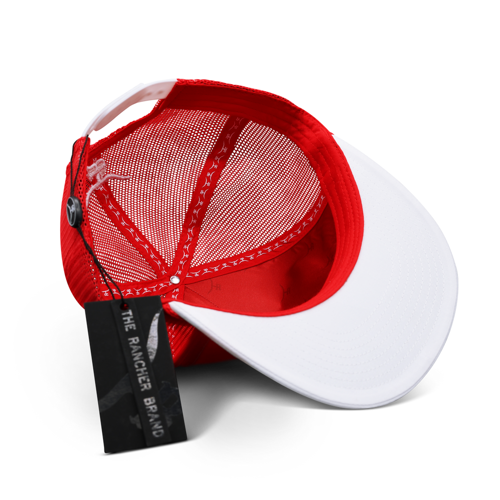 Close-up of the embroidered bronc rider design and braided red rope brim detail on the Free Hand trucker hat
