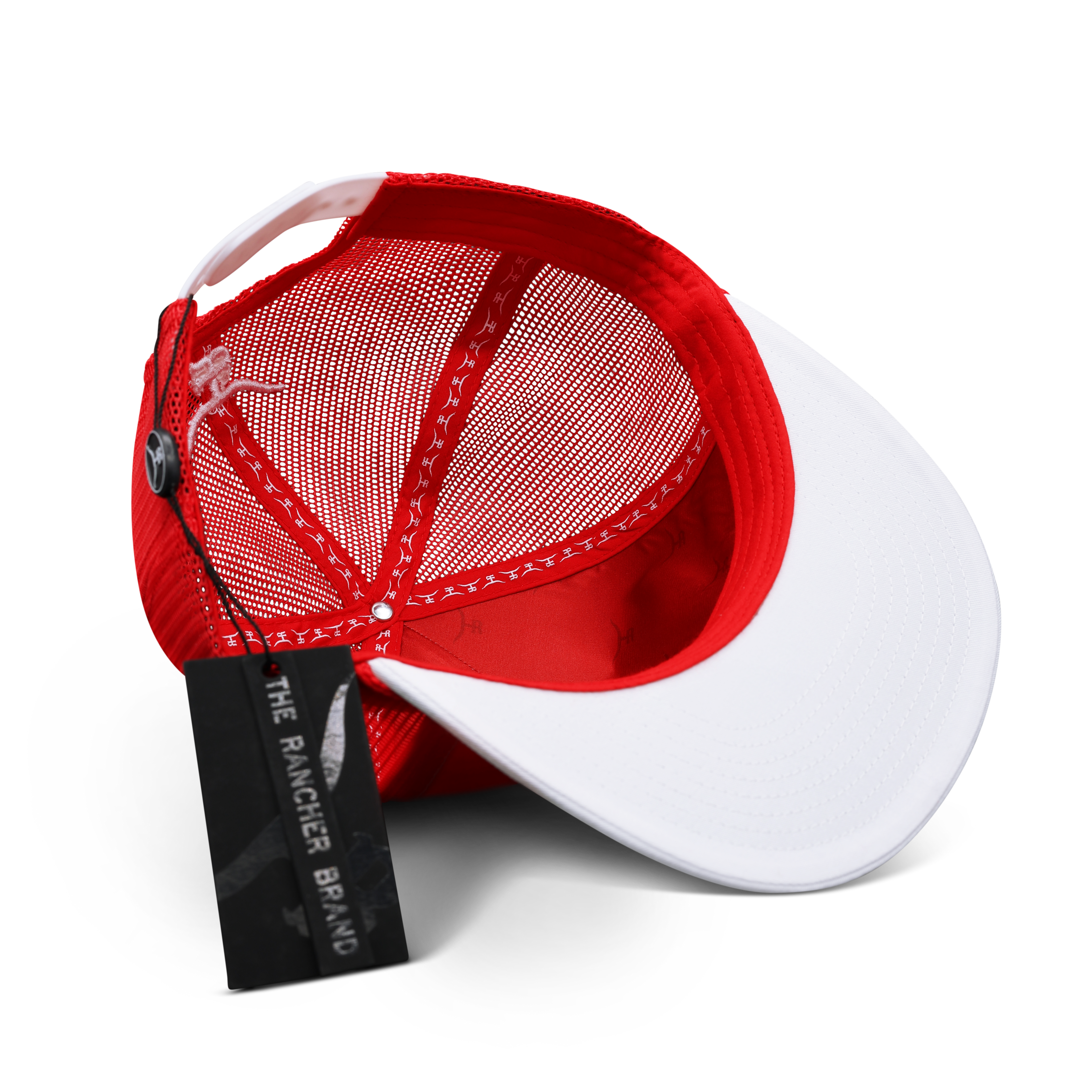 Close-up of the embroidered bronc rider design and braided red rope brim detail on the Free Hand trucker hat